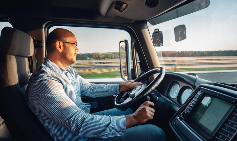 How to Choose the Best Trucking Company for Your Business Needs 3 truck driver using gps